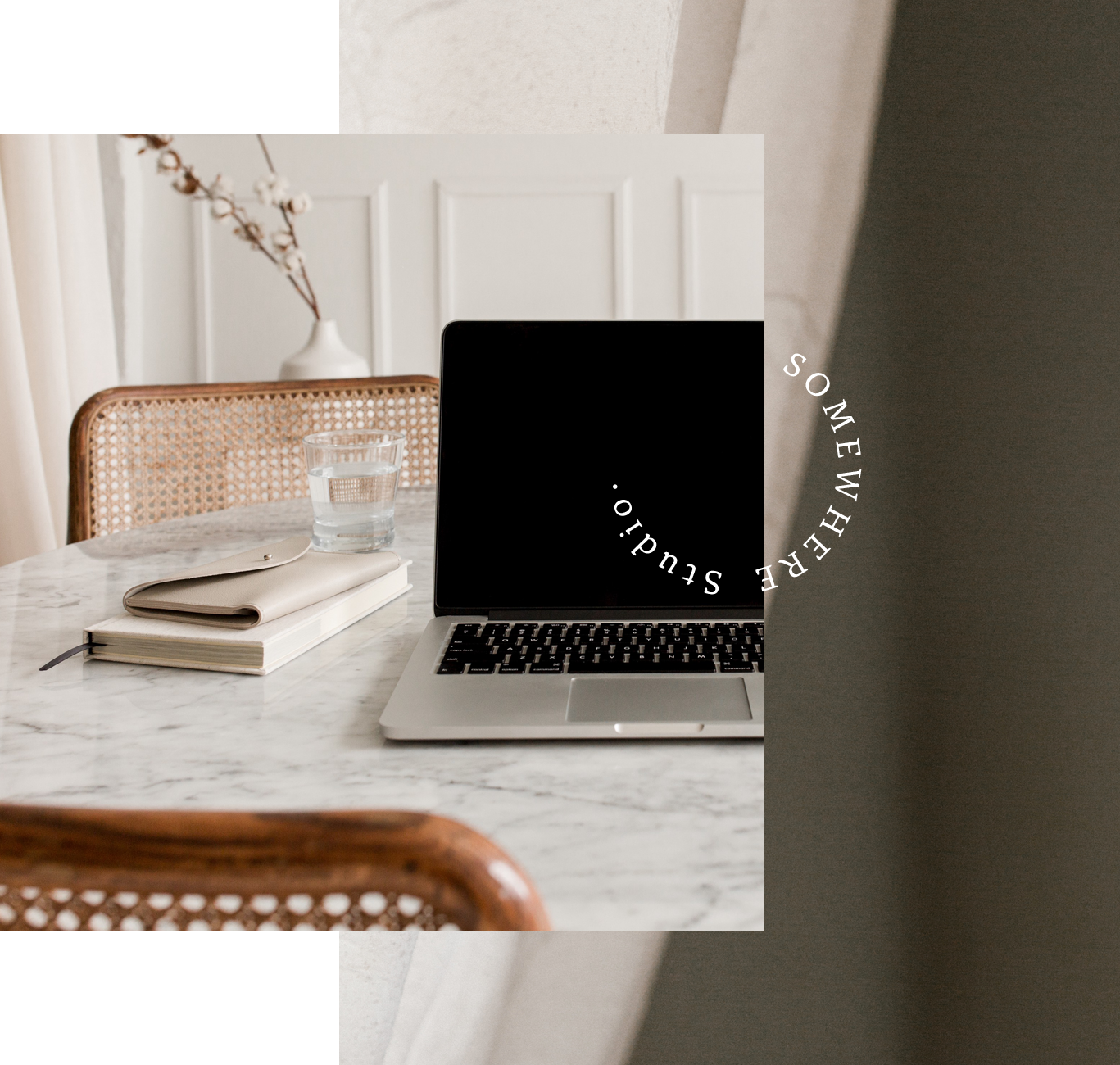 Image of laptop on desk with notepad
