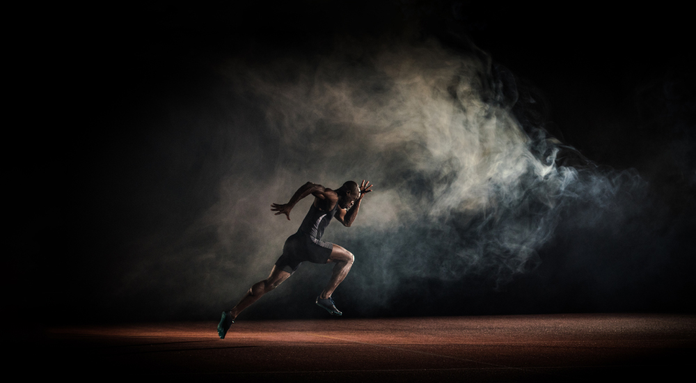 Image of man running on black background with smoke for Wellbeing Science Institute campaign