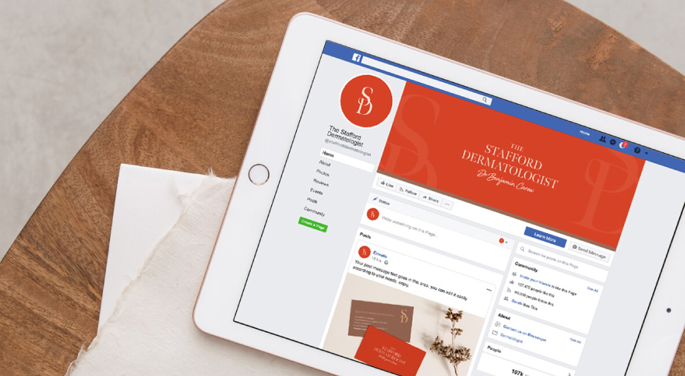 iPad sitting on desk showing Facebook profile page of The Stafford Dermatologist