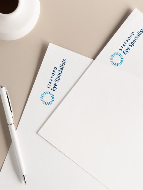 2 letterheads sitting on table showing the new Stafford Dermatologist logo