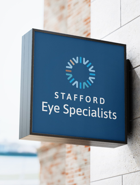 Outdoor sign on wall with new logo design